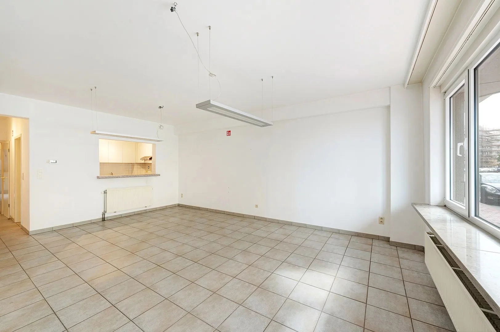 Te renoveren gelijkvloers appartement op topligging nabij het Rubensplein.