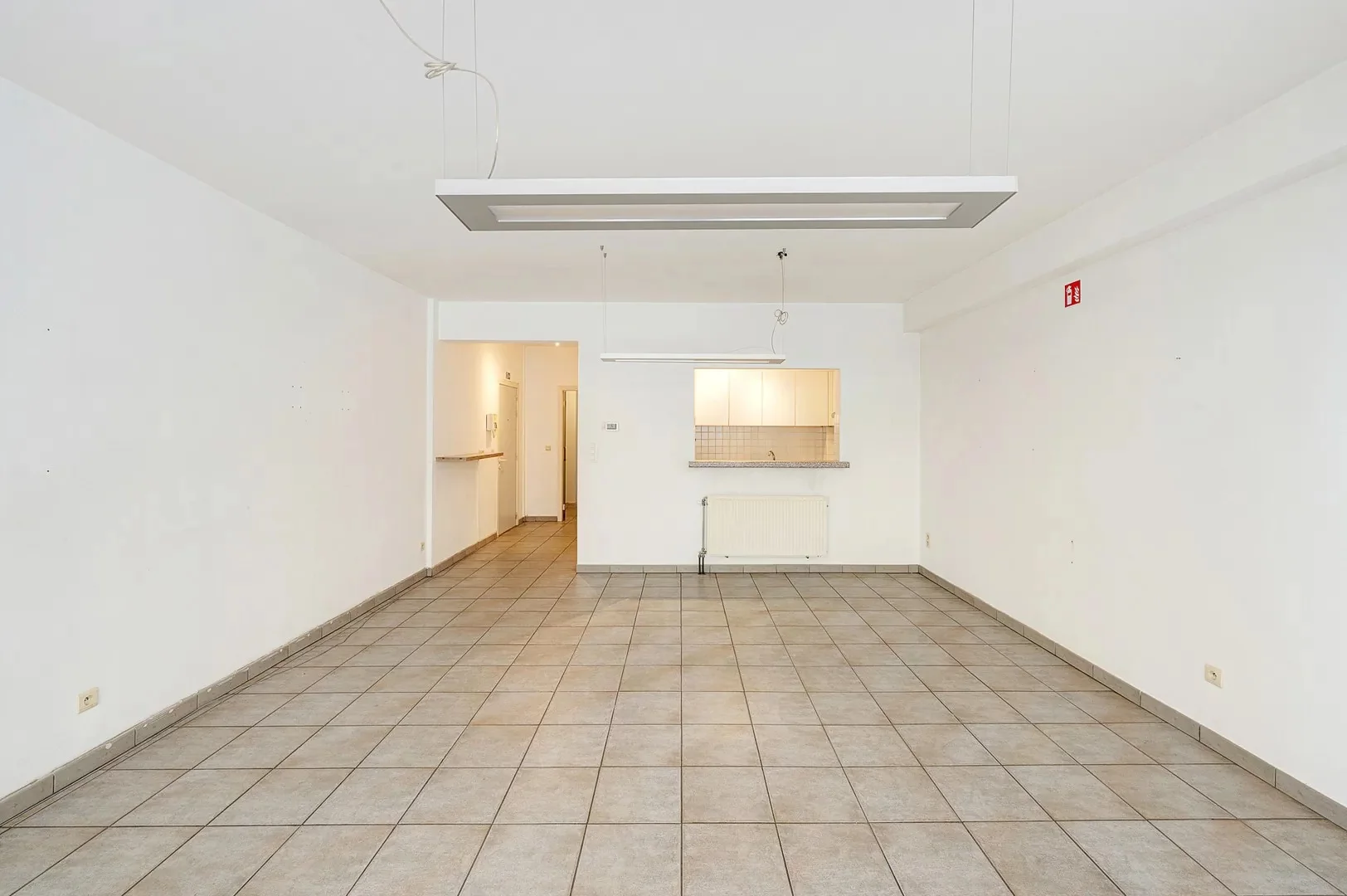 Te renoveren gelijkvloers appartement op topligging nabij het Rubensplein.