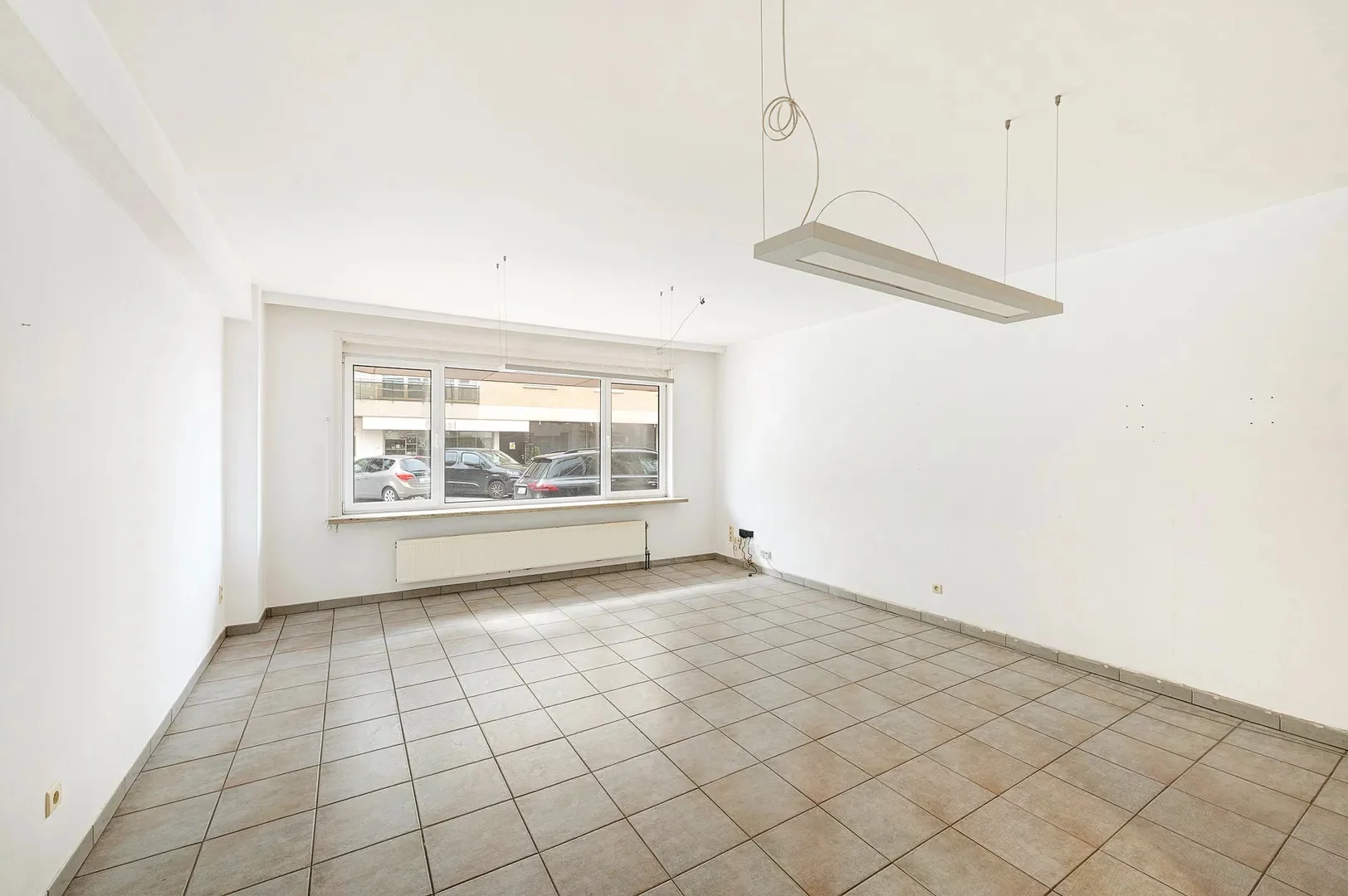 Te renoveren gelijkvloers appartement op topligging nabij het Rubensplein.